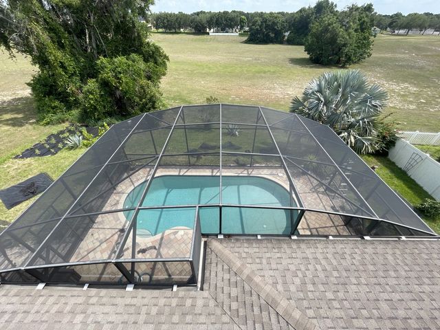 Pool deck and enclosure after pressure washing